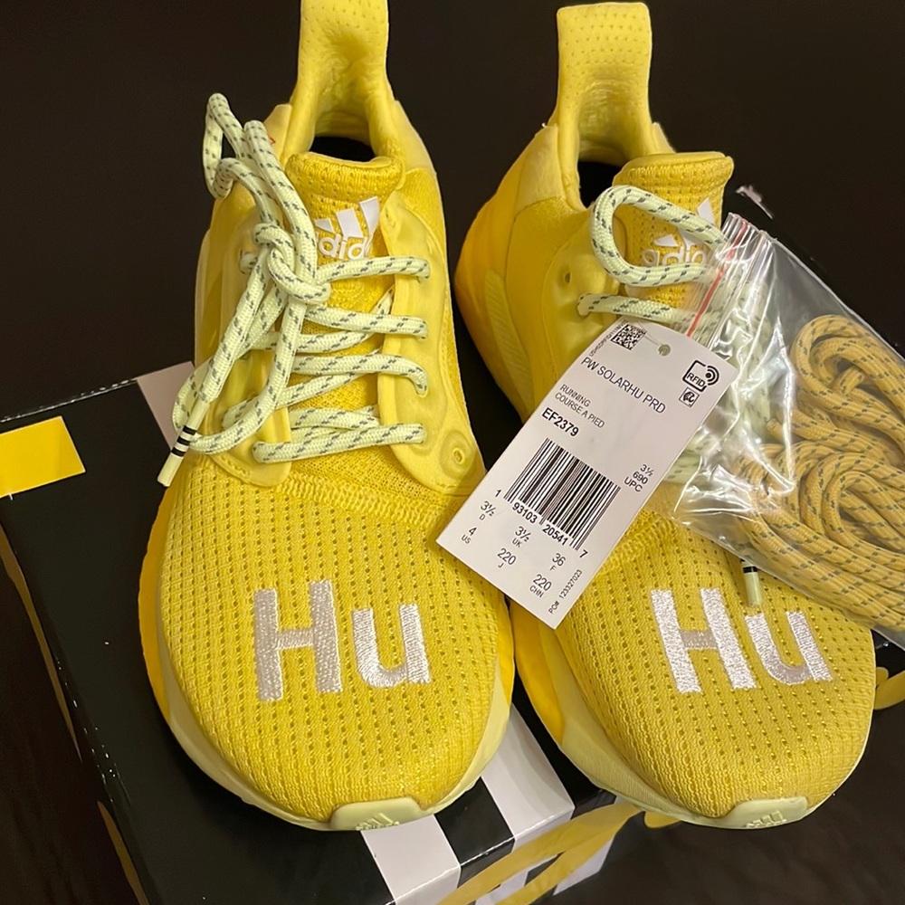 Brand new Pharrell’s adidas yellow sneakers. Womens size 5.5 or mens size 4.